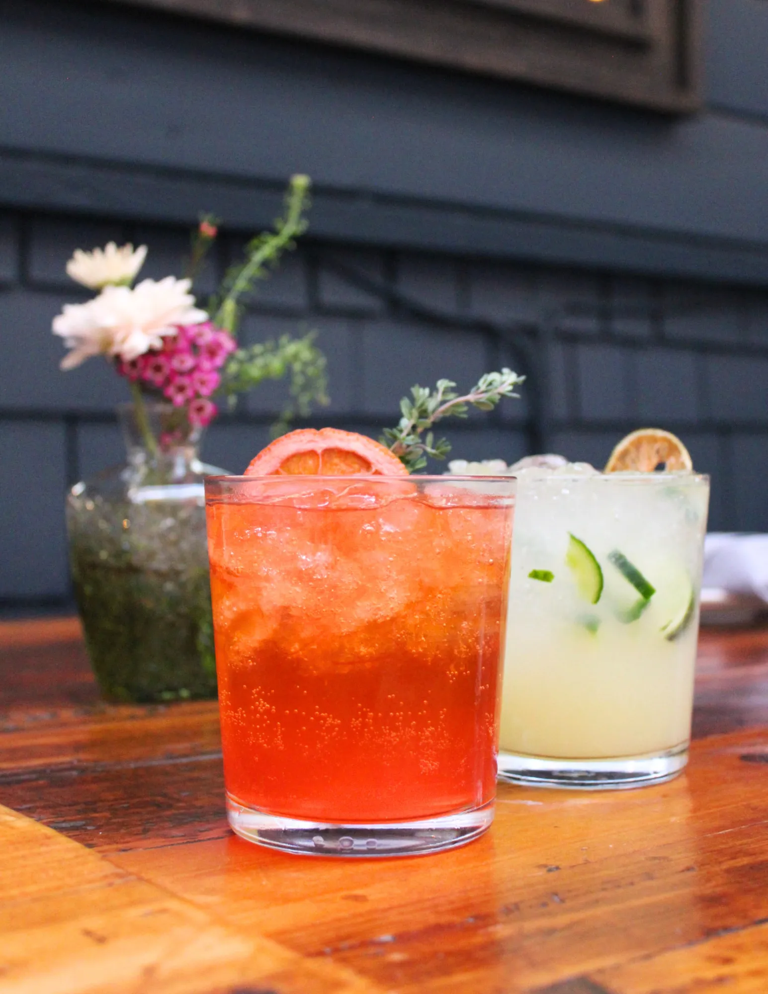 Two colorful zero-proof drinks on a table