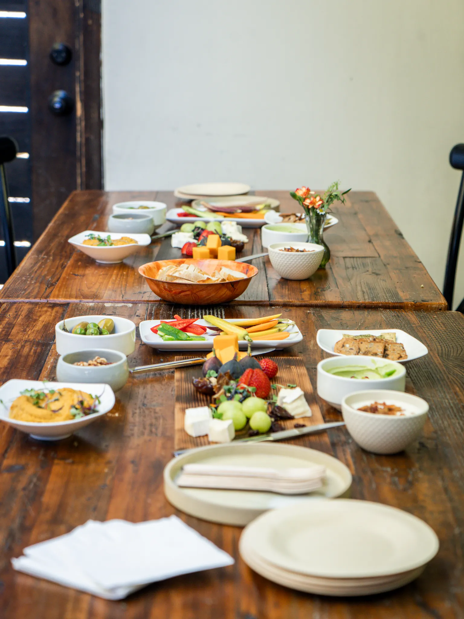 A long table set with a shared meal