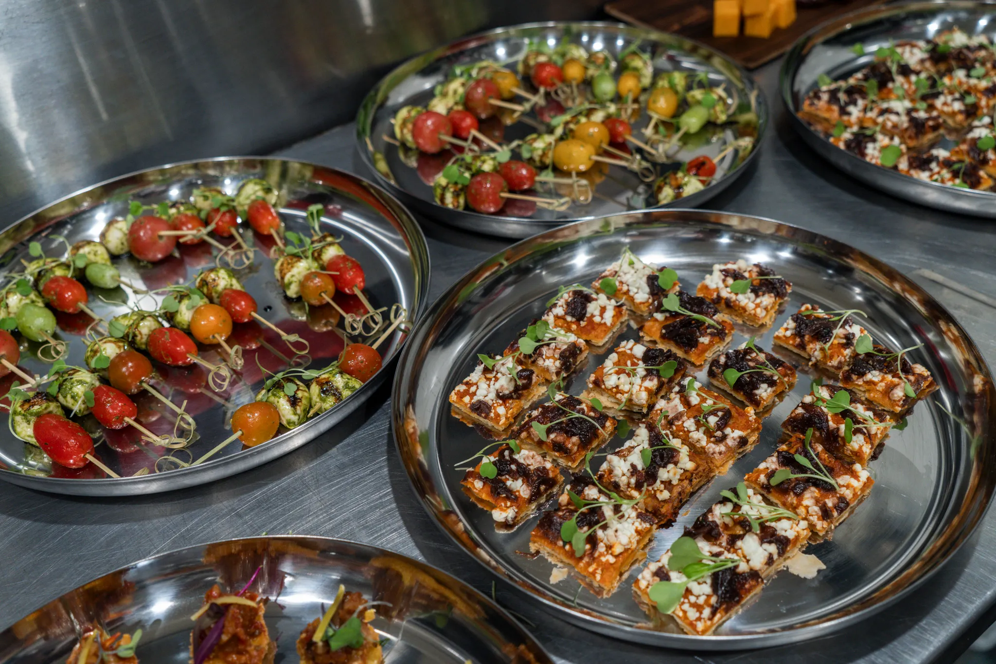 Assorted appetizers arranged on serving trays